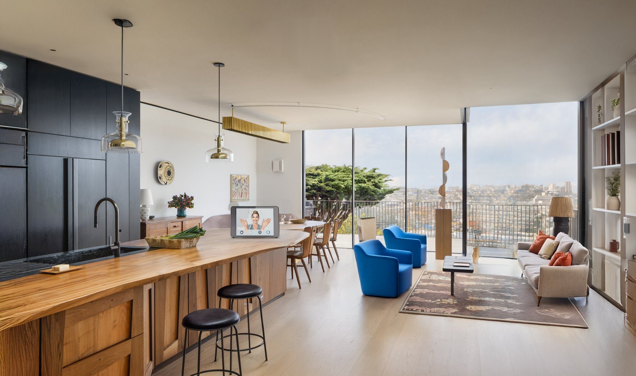 An open-plan apartment. The person selects the tablet and it turns on, then selects a humanoid robot and says “I need assistance”; the robot comes toward them.